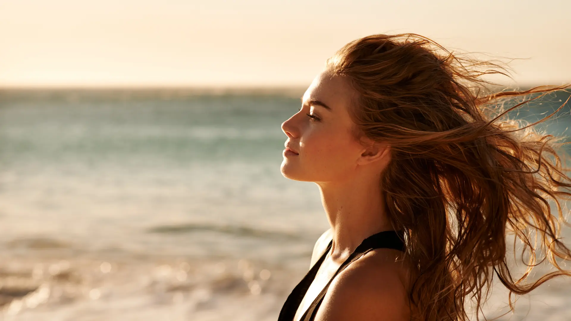 Female with long hair at beach